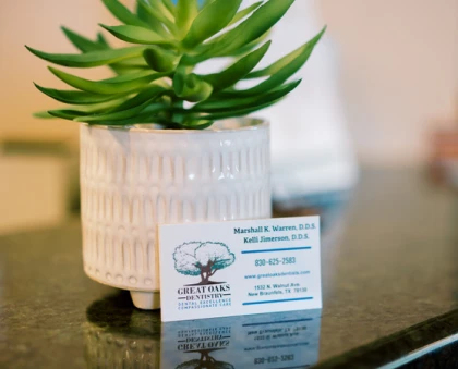 Great Oaks Dentistry business card showcasing services in New Braunfels
